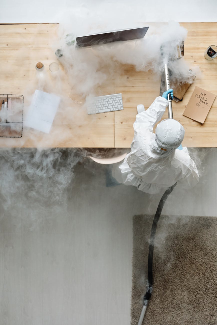 person fumigating workplace